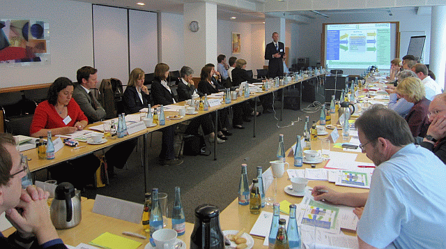 People at tables at a conference